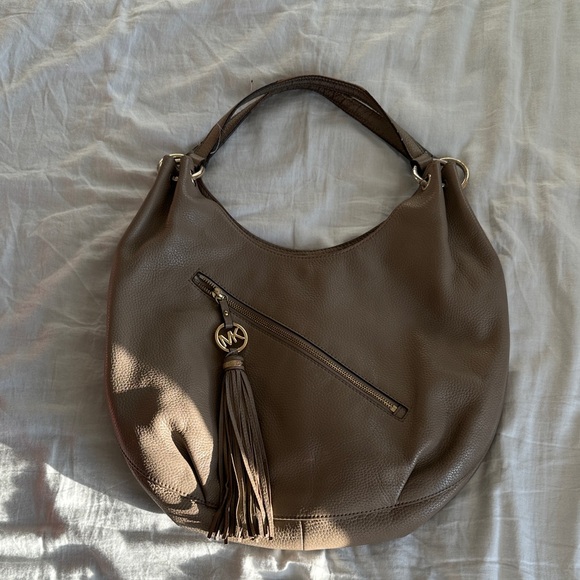 Michael Kors Handbags - Michael Kors Brown Leather Hobo with Tassel Charm